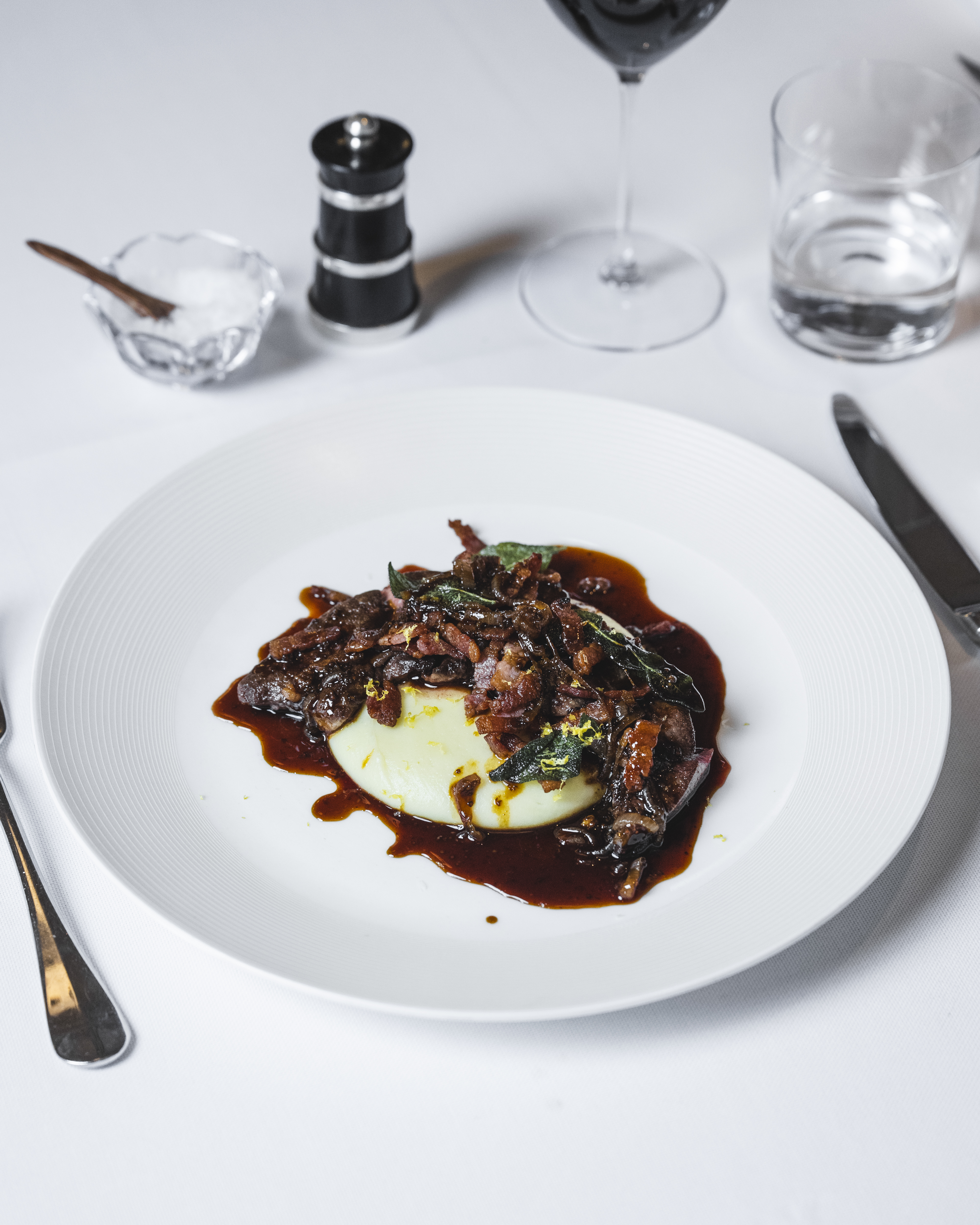 A plate of liver on mashed potato