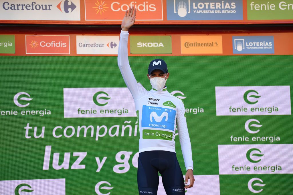 AGUILAR DE CAMPOO SPAIN OCTOBER 29 Podium Oscar Pereiro of Spain Ex Procyclist winner of the Tour of France 2006 Enric Mas Nicolau of Spain and Movistar Team White Best Young Rider Jersey Celebration during the 75th Tour of Spain 2020 Stage 9 a 1577km stage from Cid Campeador Military Base Castrillo del Val to Aguilar de Campoo lavuelta LaVuelta20 on October 29 2020 in Aguilar de Campoo Spain Photo by David RamosGetty Images