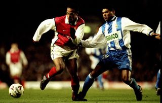 Deportivo La Coruña's Donato competes for the ball with Arsenal's Thierry Henry in a UEFA Cup clash at Highbury in March 2000.