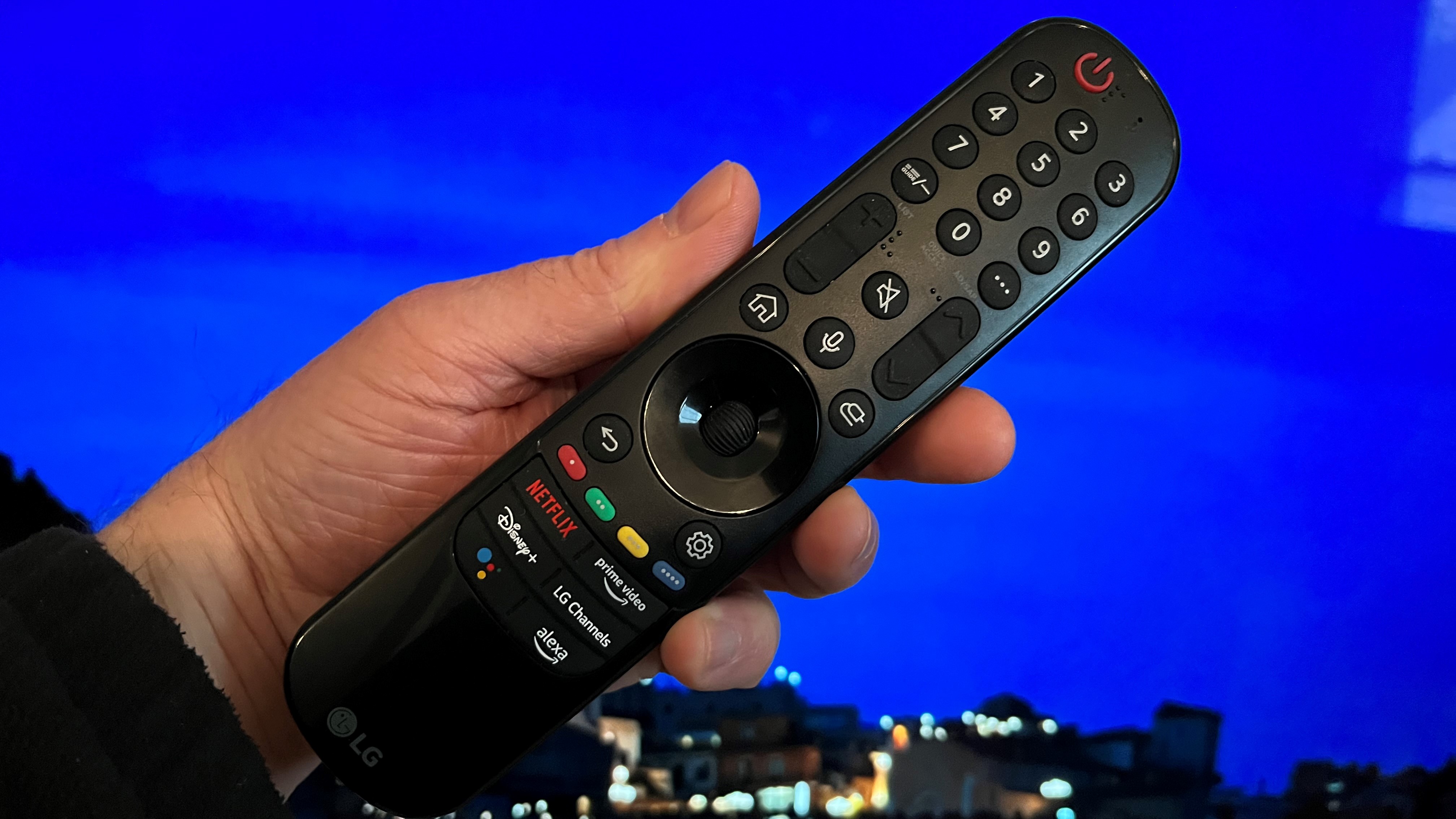 LG B2 OLED remote control on blue background