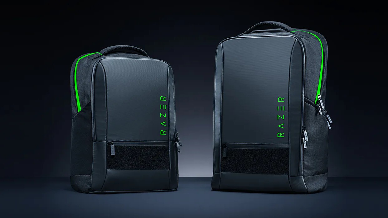 Two black backpacks side by side, one is larger.