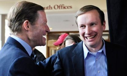 Democratic candidate for U.S. Senate Chris Murphy (right) shakes hands with U.S. Sen. Richard Blumenthal (D-Conn.) at a rally in Hartford, Conn. on Nov. 5.