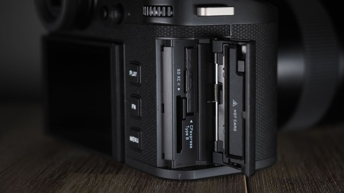 Leica SL3-S on a wooden surface with moody lighting