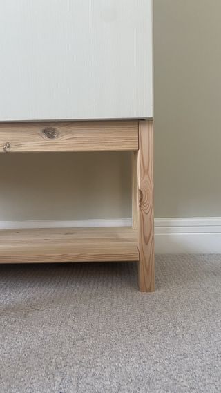 An IKEA IVAR cabinet on wooden base legs