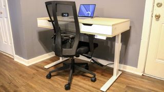 Realspace Smart Electric Height-Adjustable Desk with laptop and office chair