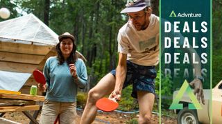 Man and woman wearing Patagonia clothing playing table tennis