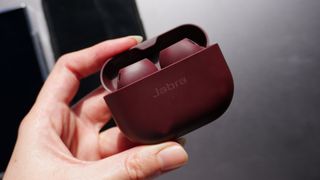 A person hand holding the Jabra Elite 10