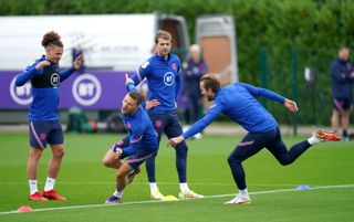 England captain Harry Kane tries to catch Kieran Trippier during an England training session