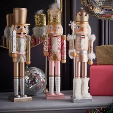 nutcracker decorations with pink nutcrackers and wooden nutcracker ornaments