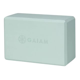 mint green foam yoga block in a rectangular shape
