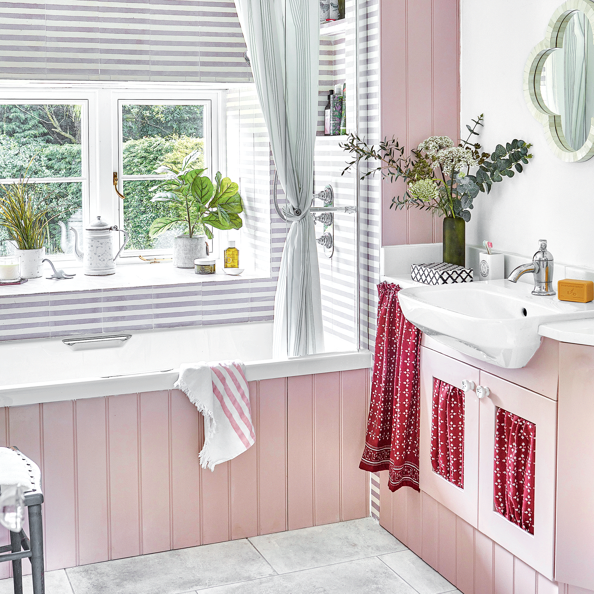 Pink bathroom with red sink curtain