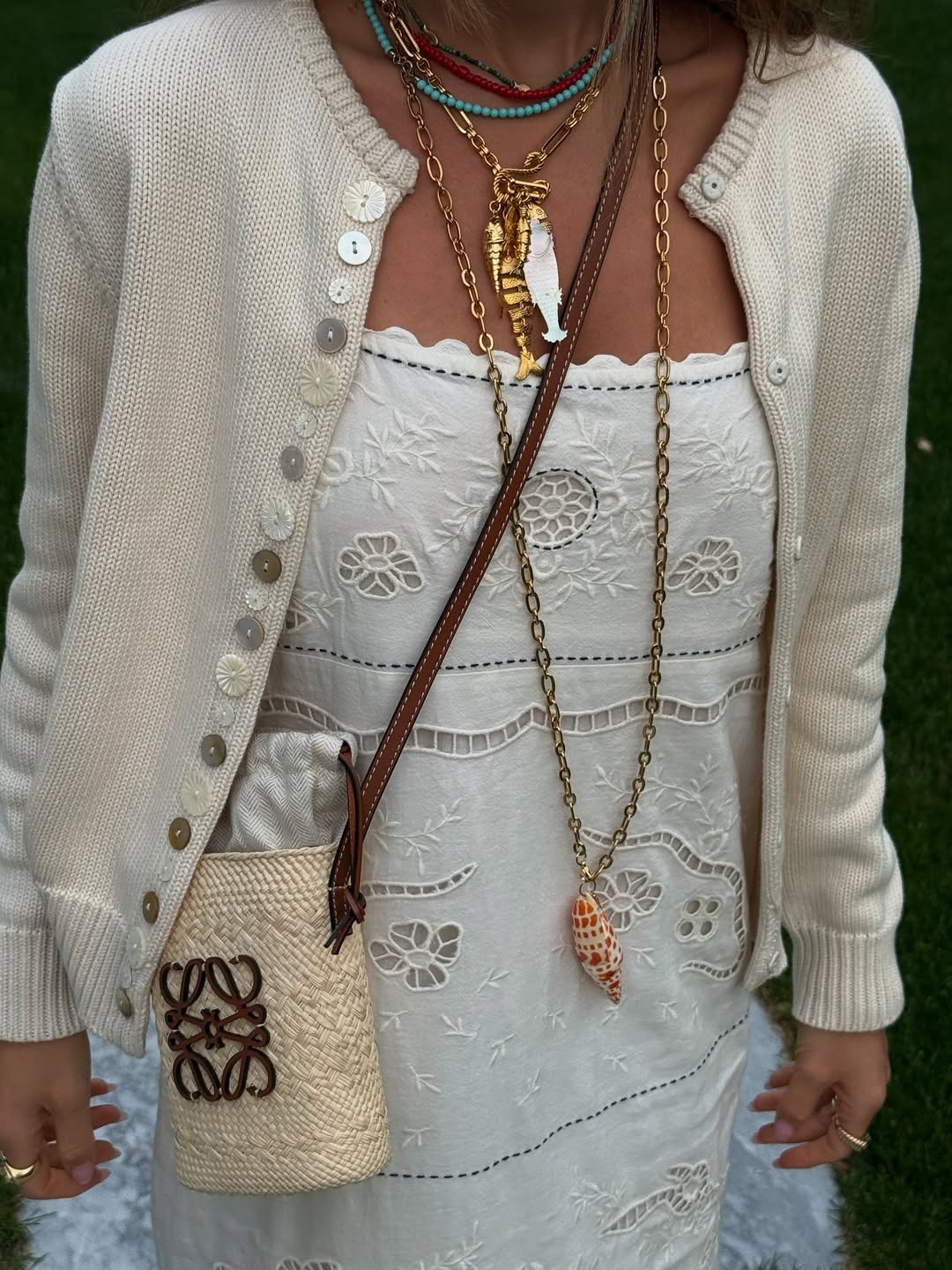 Woman in white dress and ocean-inspired jewelry