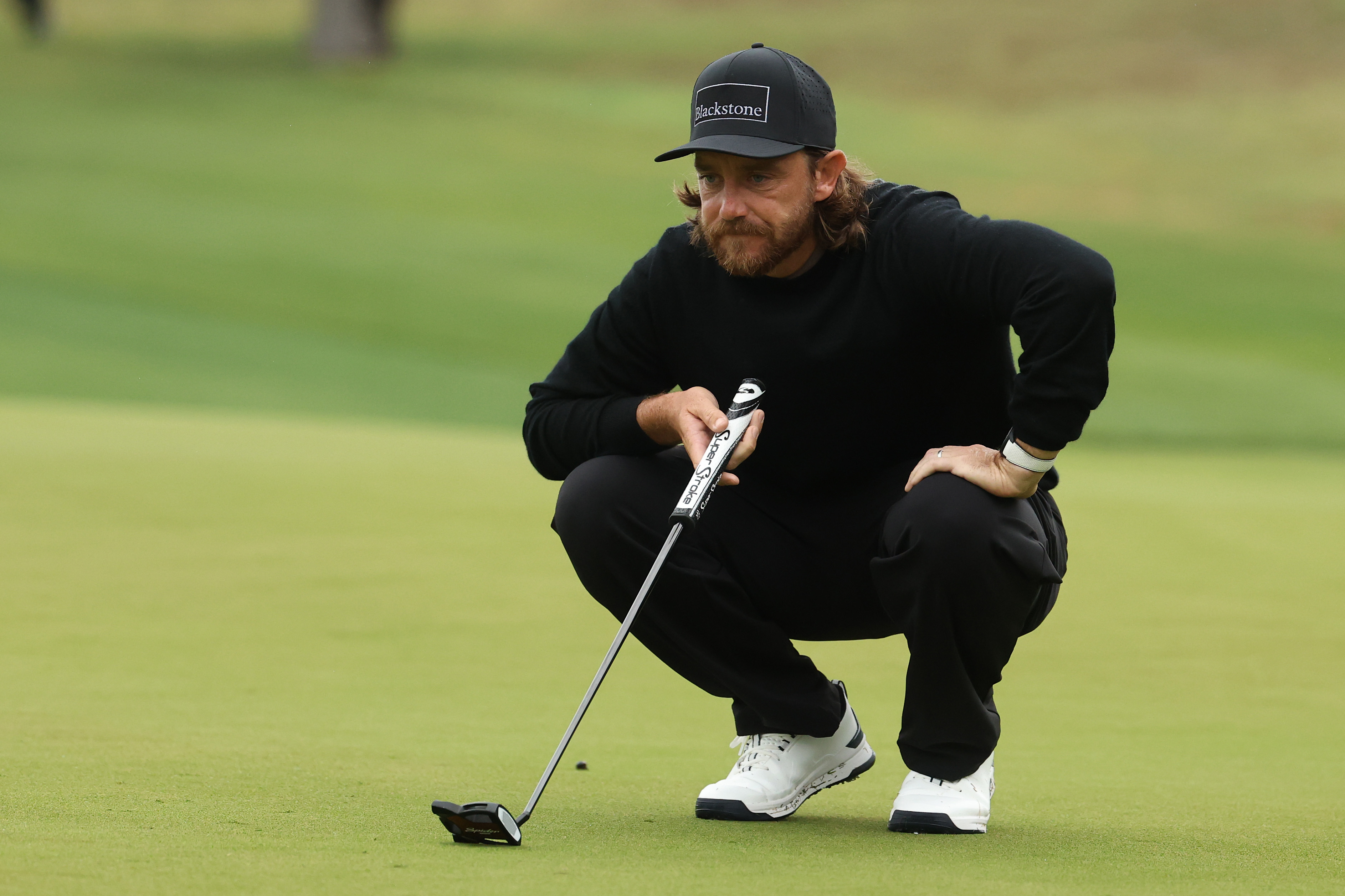 Tommy Fleetwood lines up a putt on the tenth green during the first round of the Valero Texas Open 2026 at TPC San Antonio