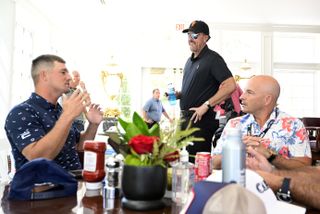 DeChambeau and Mickelson chat at the LIV Golf event