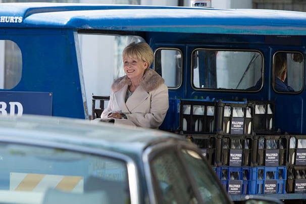 Peggy-takes-a-trip-on-the-back-of-the-milk-float.jpg