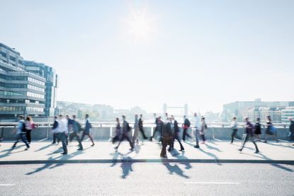 Commuters walking to work through the city