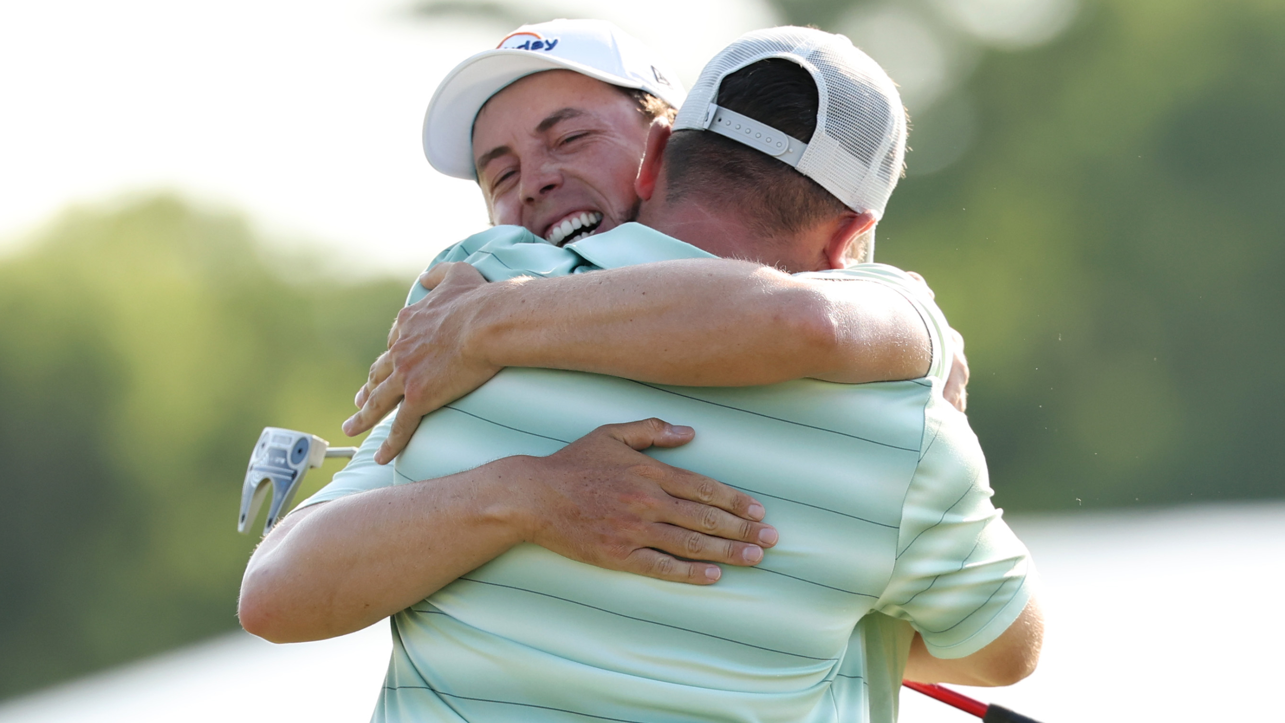Matt and Alex Fitzpatrick embrace after winning the Zurich Classic of New Orleans