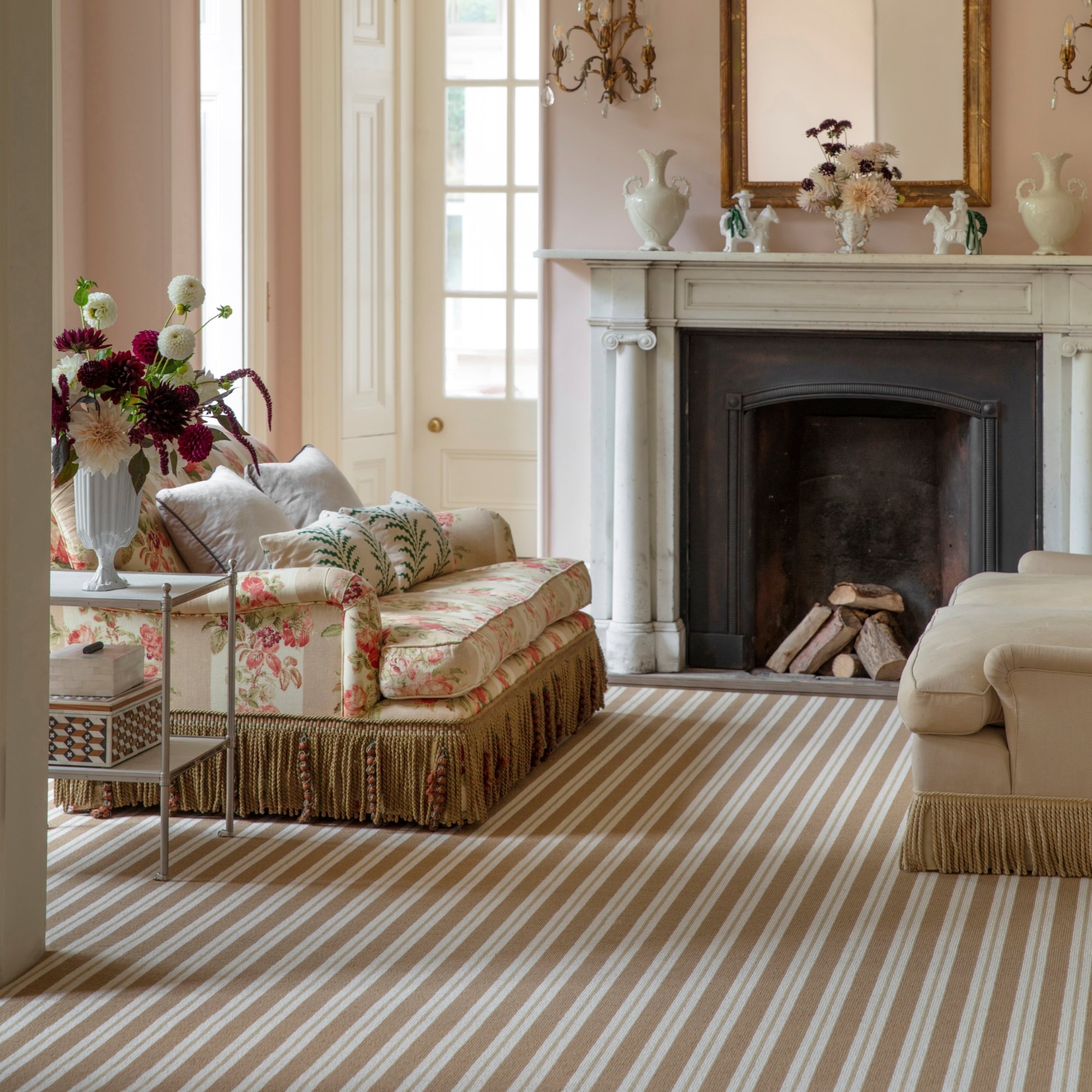 The Wool Candy striped carpet in beige from Alternative Flooring in a pink-painted living room with a marble fireplace