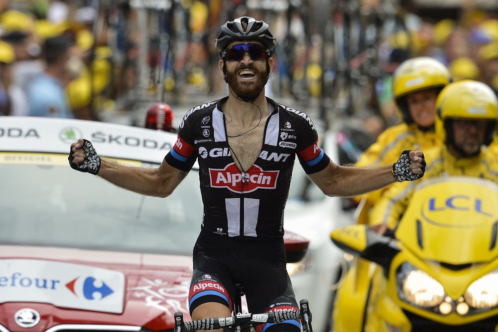 Simon Geschke celebrates as he crosses the finish line to win stage 17 of the 2015 Tour de France