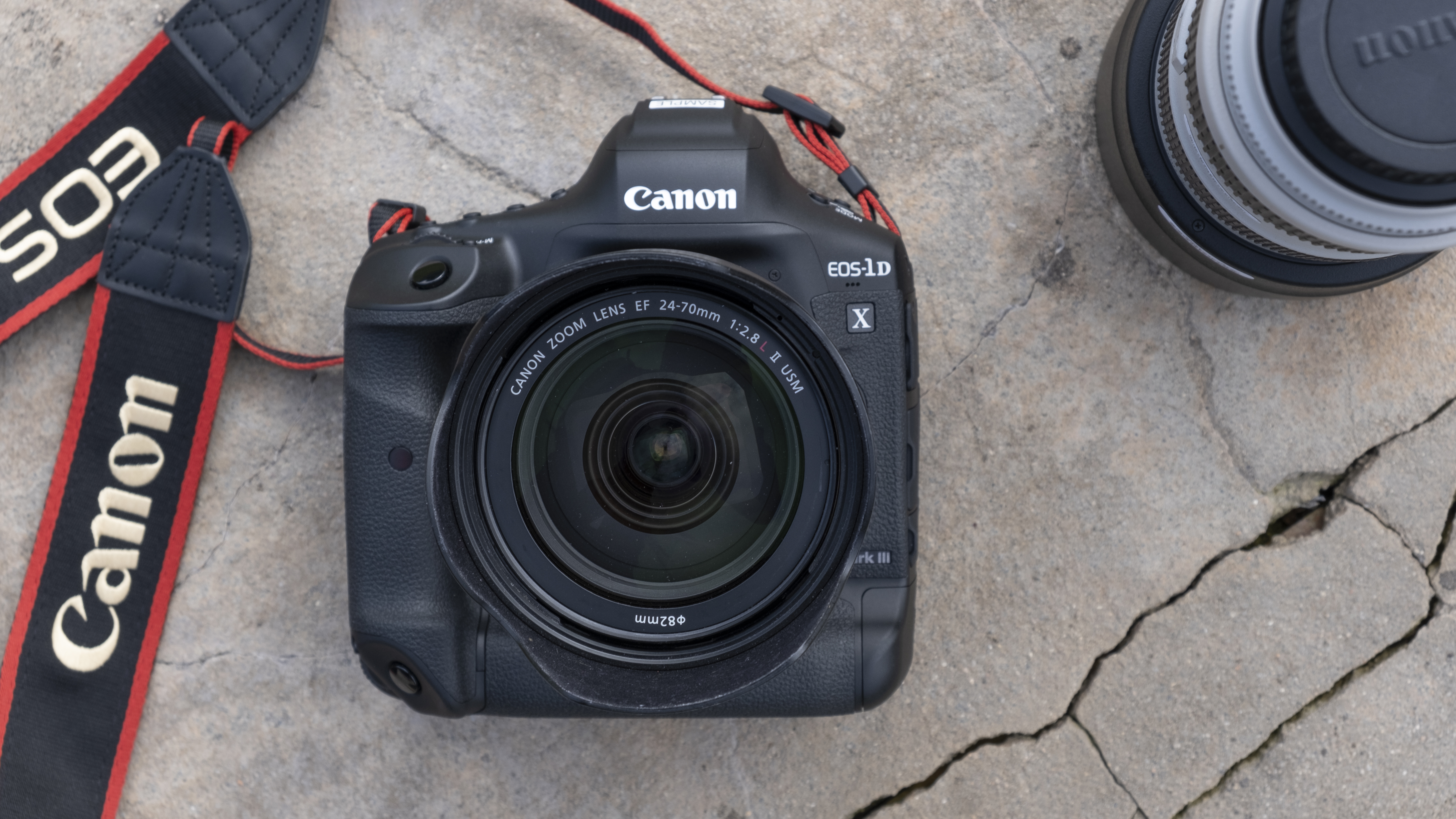 best DSLR camera Canon 1DX Mark III lying face up on the ground