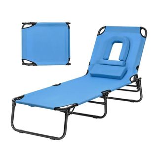A blue fabric lounge chair with a head hole and pillow