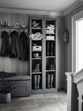 boot room in hallway with cubbies, peg rail and bench seat