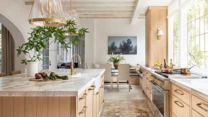 Wooden kitchen with white marble countertops