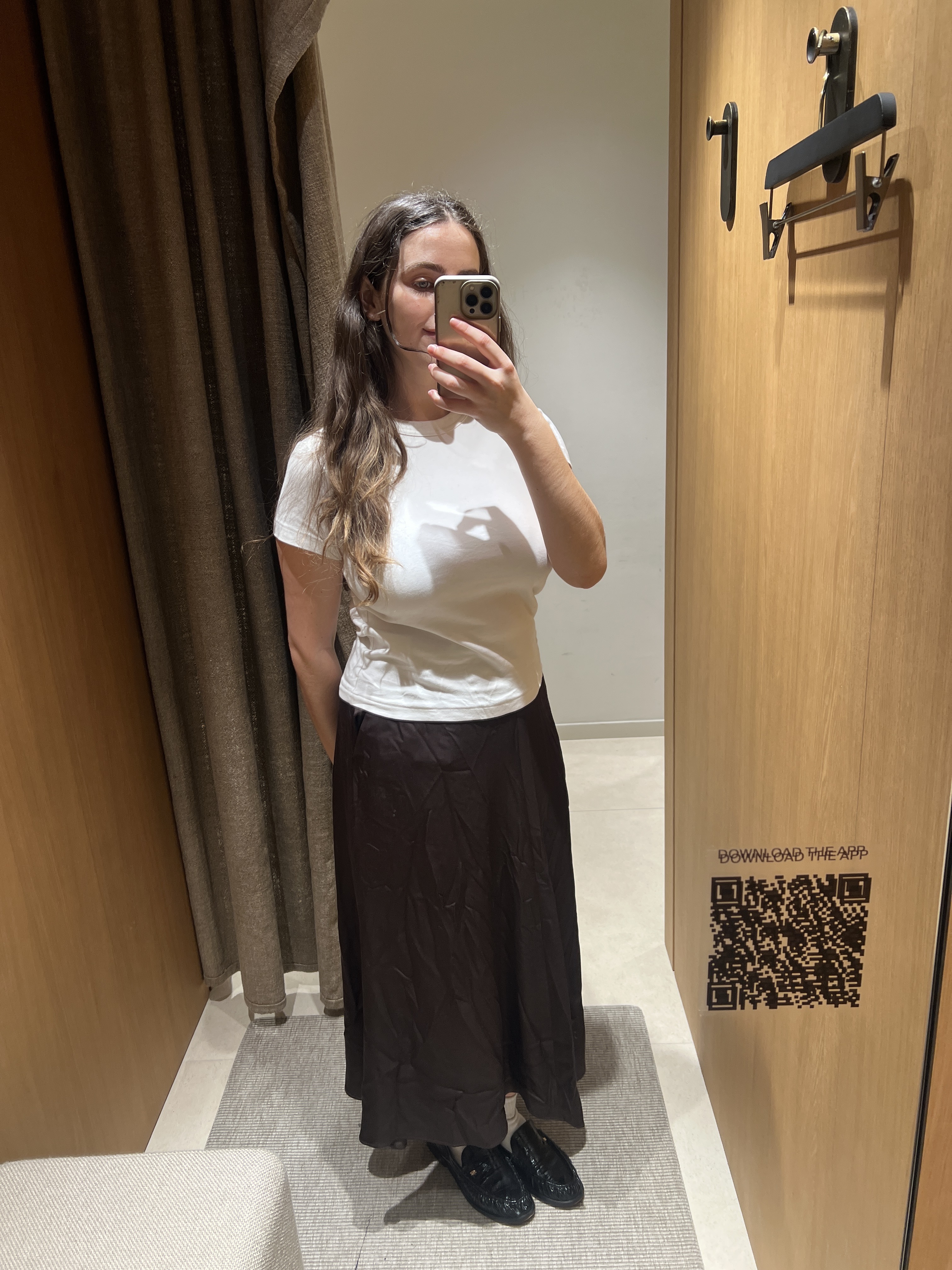 An image of Who What Wear UK's SEO Writer Ava Gilchrist wearing a satin skirt from Massimo Dutti.