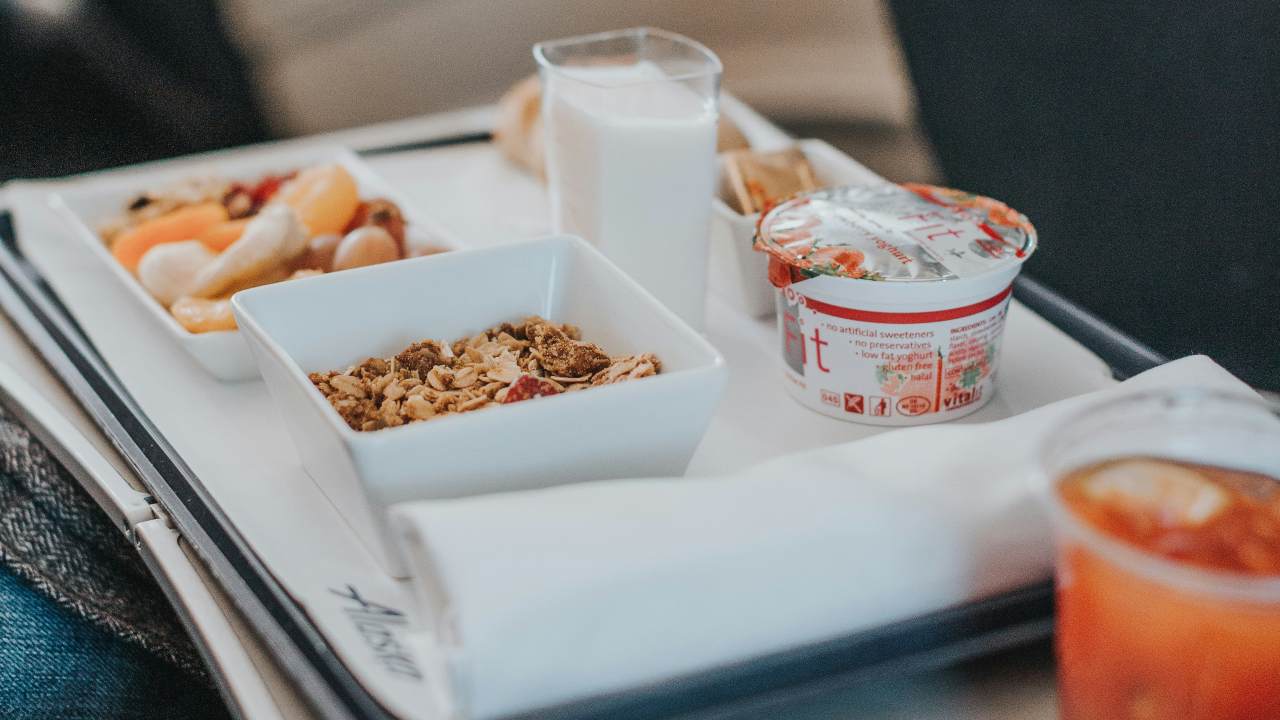 A plane tray table filled with food