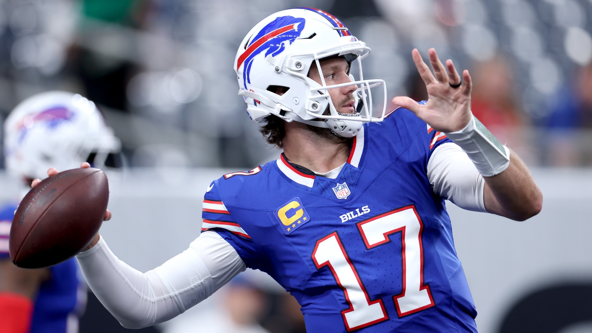 Buffalo Bills quarterback Josh Allen throwing a ball
