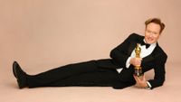 Host Conan O'Brien poses with an Oscars statue ahead of the 98th Academy Awards