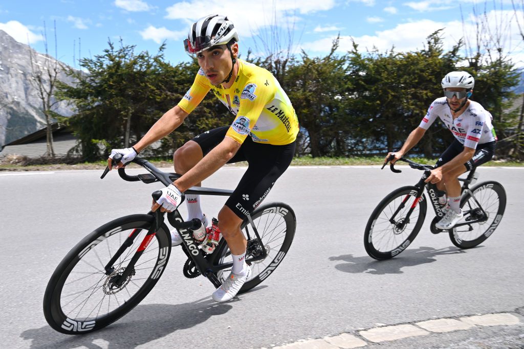 LEYSIN SWITZERLAND APRIL 27 LR Juan Ayuso of Spain Yellow Leader Jersey and Adam Yates of The United Kingdom and UAE Team Emirates compete during the 77th Tour De Romandie 2024 Stage 4 a 1592km stage from Saillon to Leysin 1314m UCIWT on April 27 2024 in Leysin Switzerland Photo by Luc ClaessenGetty Images