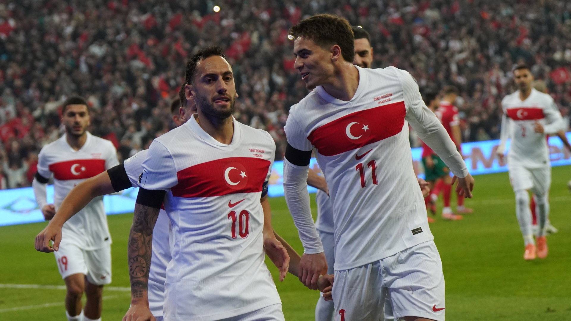 Turkey's Hakan Calhanoglu celebrating with Kenan Yildiz