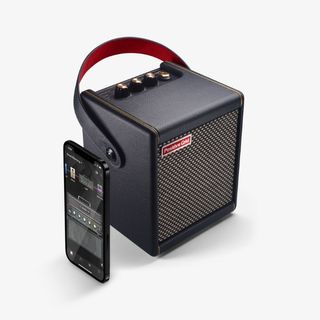 A Positive Grid Spark Mini amp with a smartphone