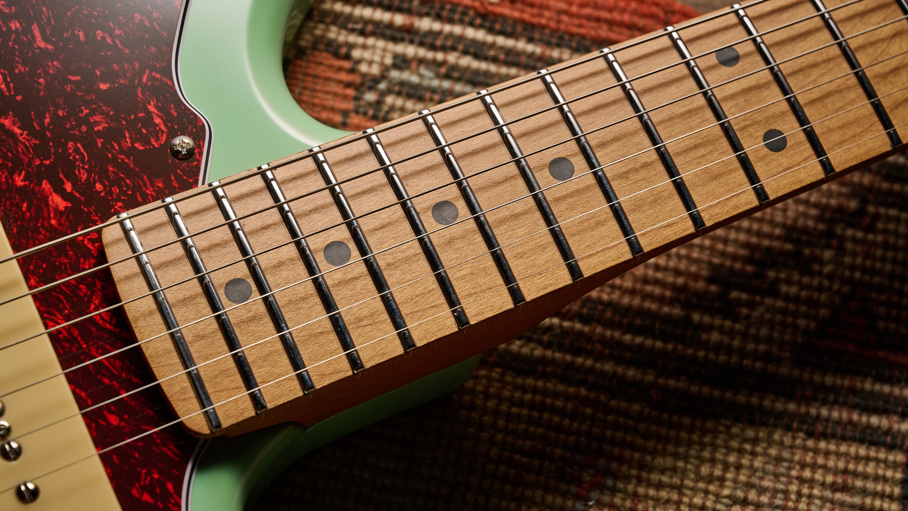 Close up of the roasted maple neck on a Jet JJ-300 P90 offset guitar