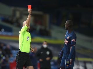 Nicolas Pepe, right, was sent off at Elland Road (Molly Darlington/PA)