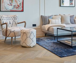 living room with pale herringbone wooden flooring