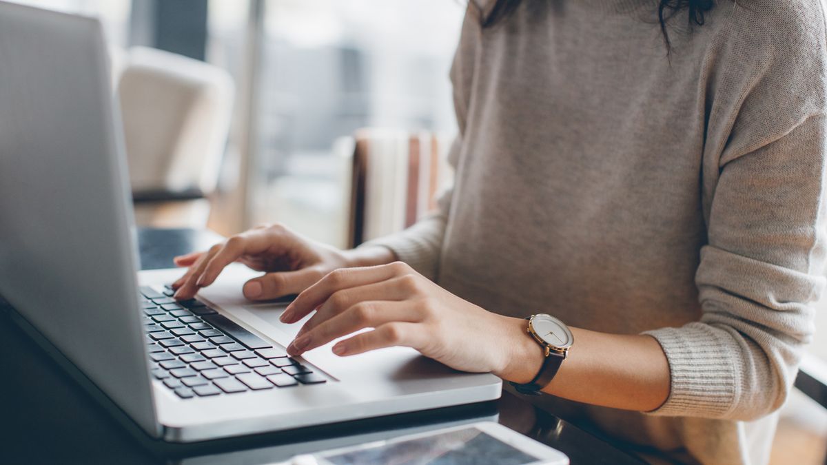 woman typing on laptop 