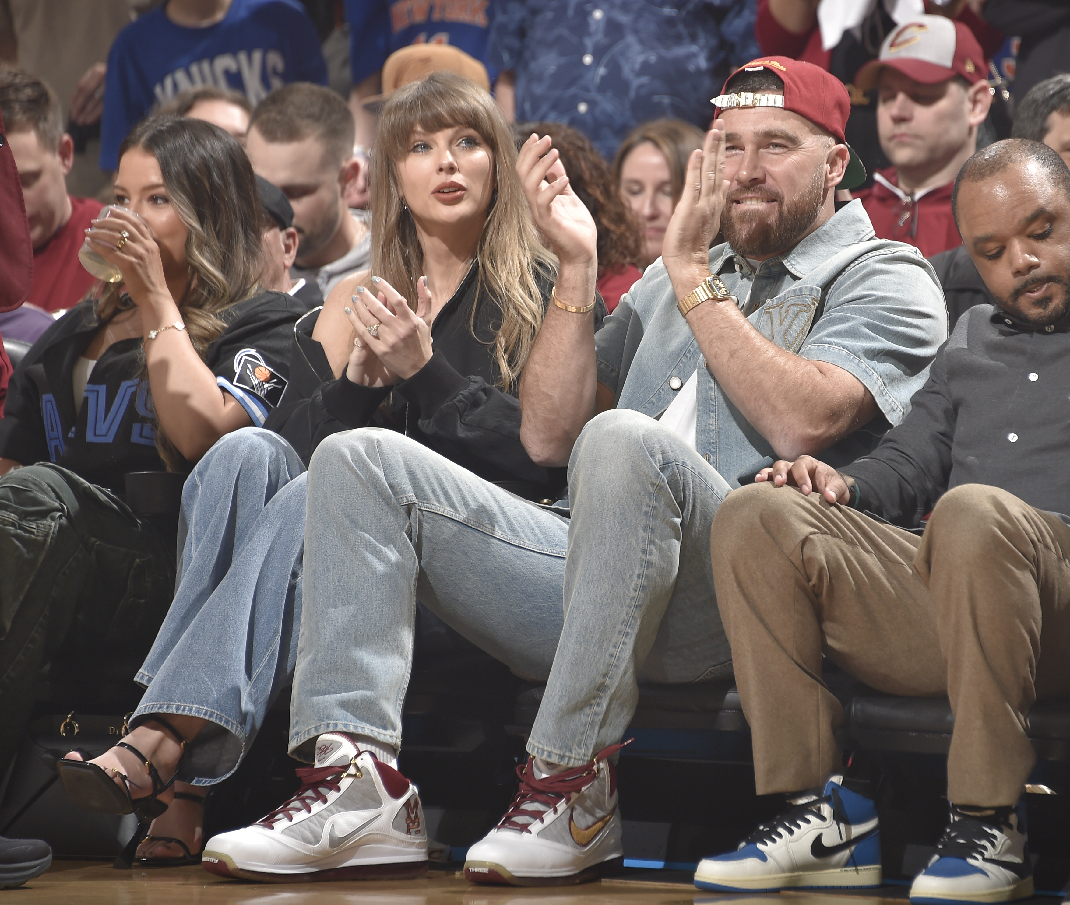 Taylor Swift and Travis Kelce attend the NBA conference finals wearing matching denim
