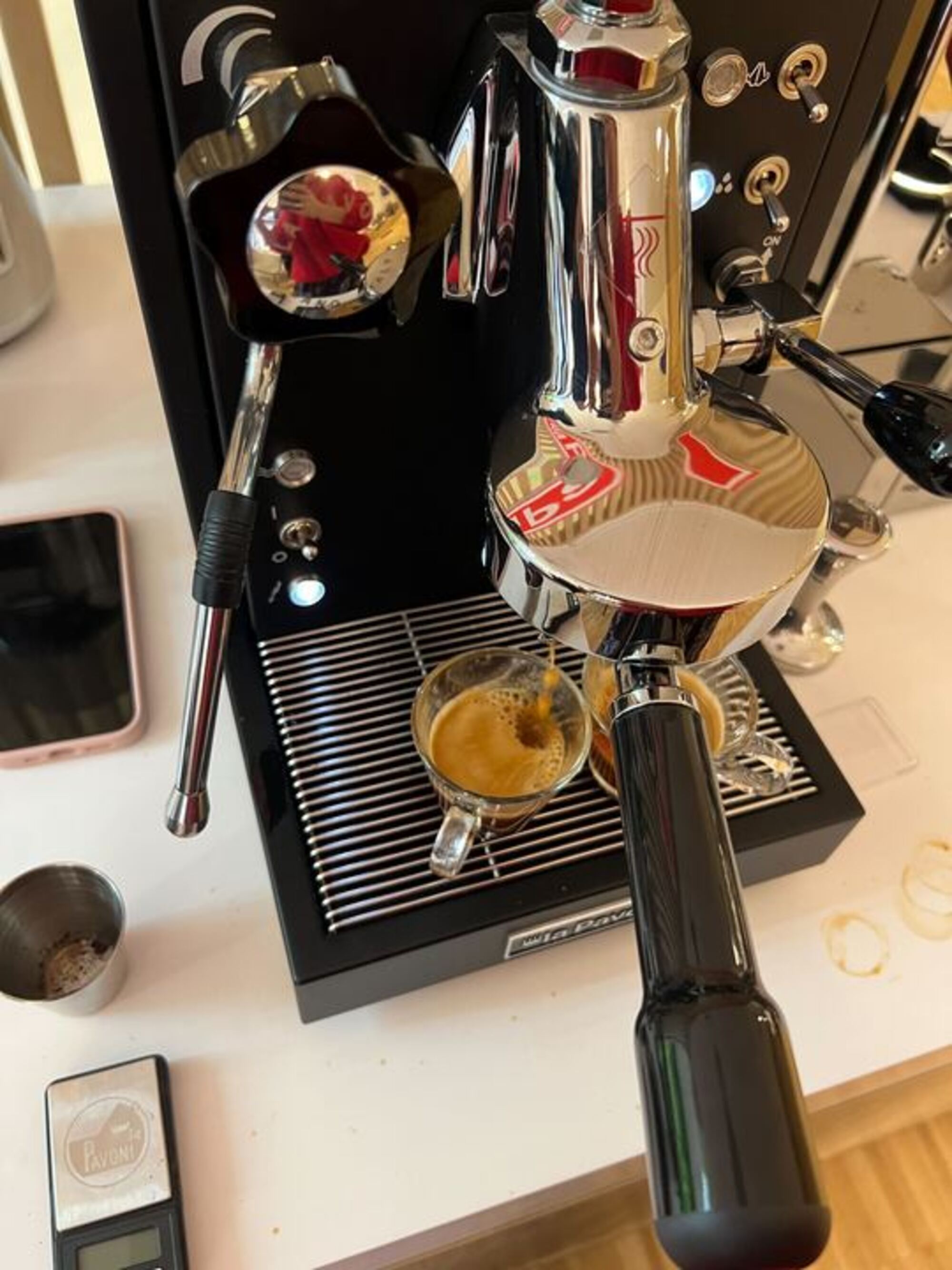 Image of a black La Pavoni Mini Cellini Semi-Professional Domestic Coffee Machine brewing two shots of espresso.