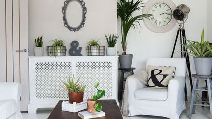 DIY wooden radiator cover over radiator in panelled wall living room