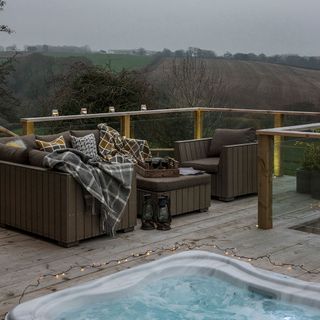 sofa set and hot tub on terrace