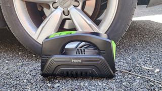 Prow Electric Air Compressor in use on car tire