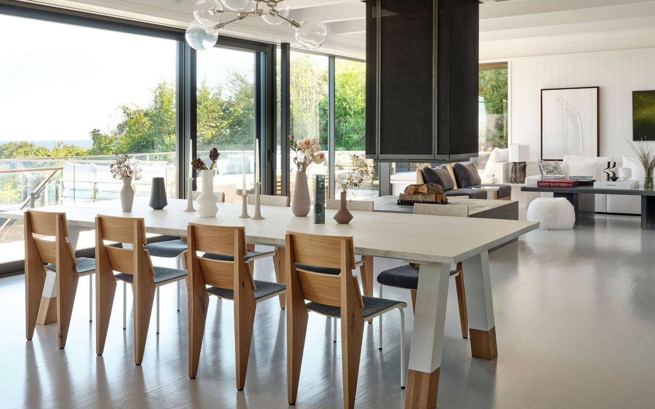 open plan dining and living room in white with wood and black accents