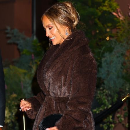 Jennifer Lopez wearing a brown fur coat.
