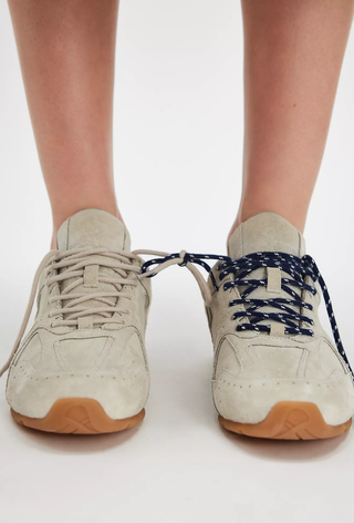 An image of suede trainers, one of the trainers that are in fashion.