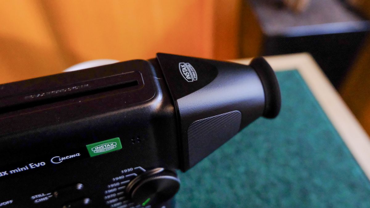 A black Fujifilm Instax mini Evo Cinema hybrid instant camera