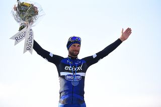 Tom Boonen waves from the podium
