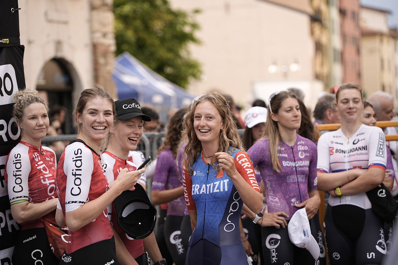Cofids and Ceratizit-WNT wait to step up on stage at the 2024 Giro d'Italia Women teams presentation at the Piazza della Loggia in Brescia