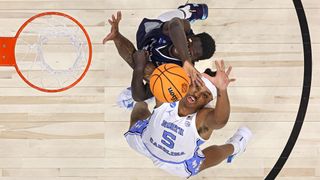 Armando Bacot #5 of the North Carolina Tar Heels and Fousseyni Drame #10 of the St. Peter's Peacocks battle for a rebound during the Elite Eight round game of the 2022 NCAA Men's Basketball Tournament at Wells Fargo Center on March 27, 2022 in Philadelphia, Pennsylvania.